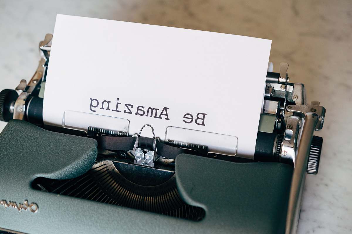  white printer paper on black typewriter 