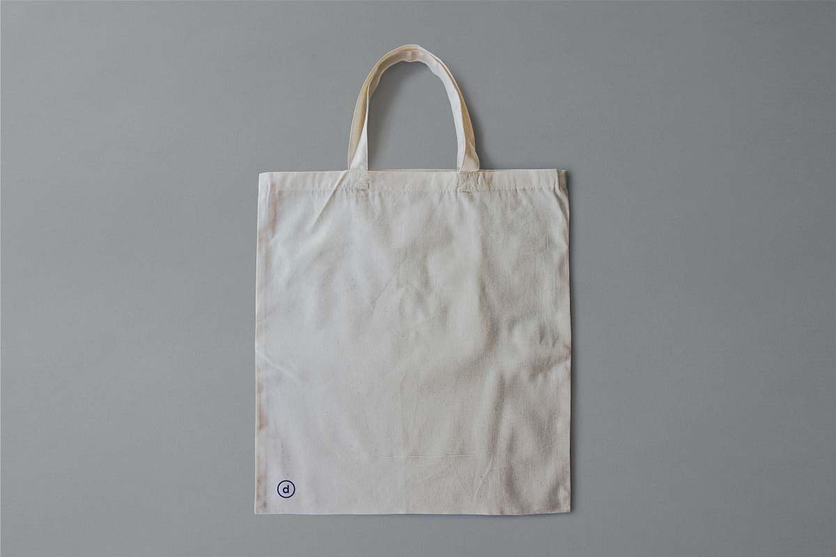 accessory white reusable bag on gray surface bag