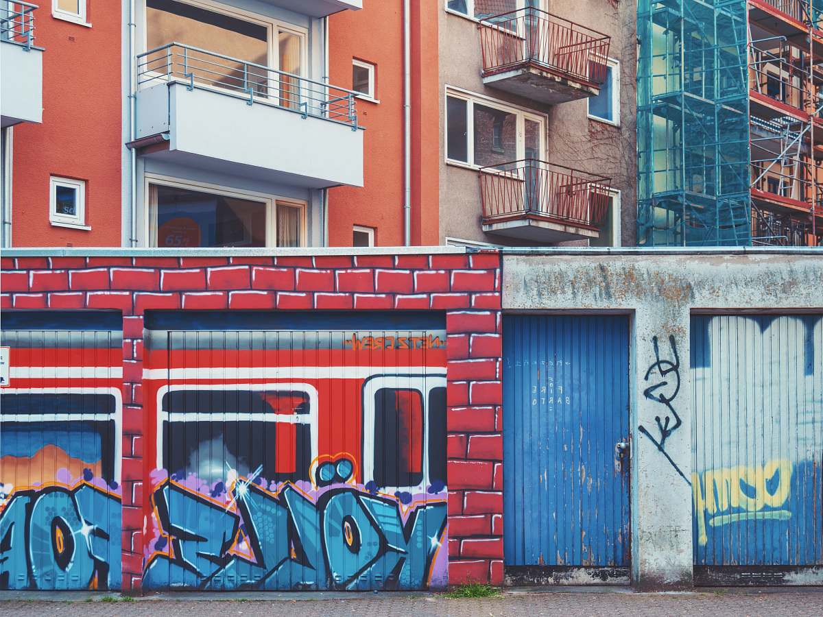 germany wall with murals during day graffiti