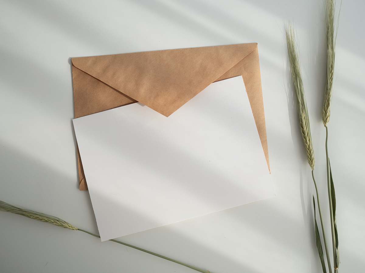 mock white paper and brown envelope mail