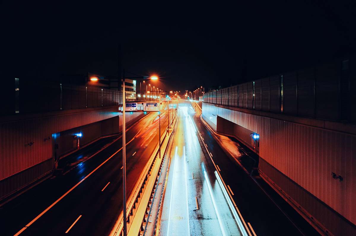 highway empty road with streaks of light during nighttime time lapse photography munich