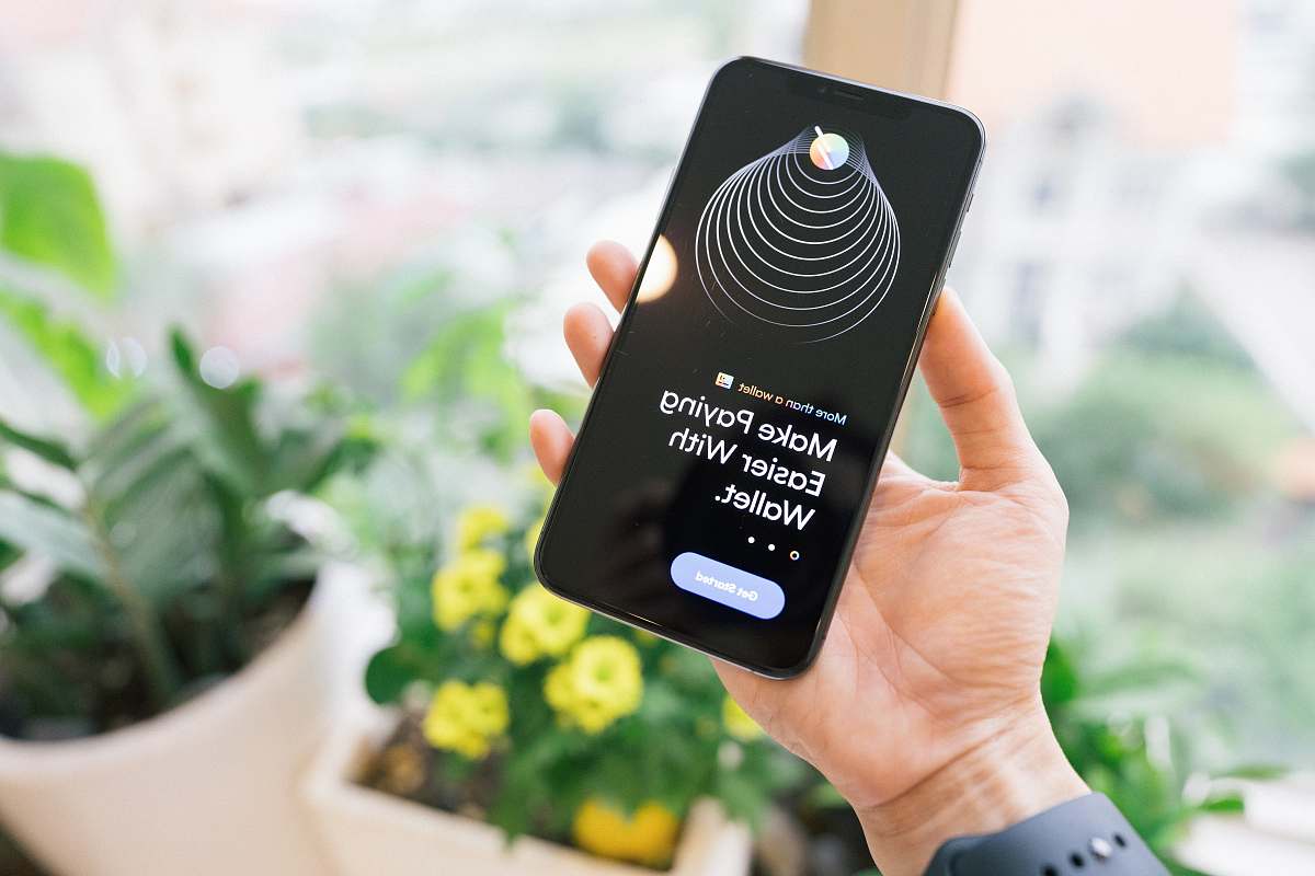 person person holding black iphone 4 iphone