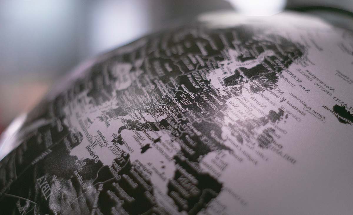 globe grayscale photo of desk globe outer space