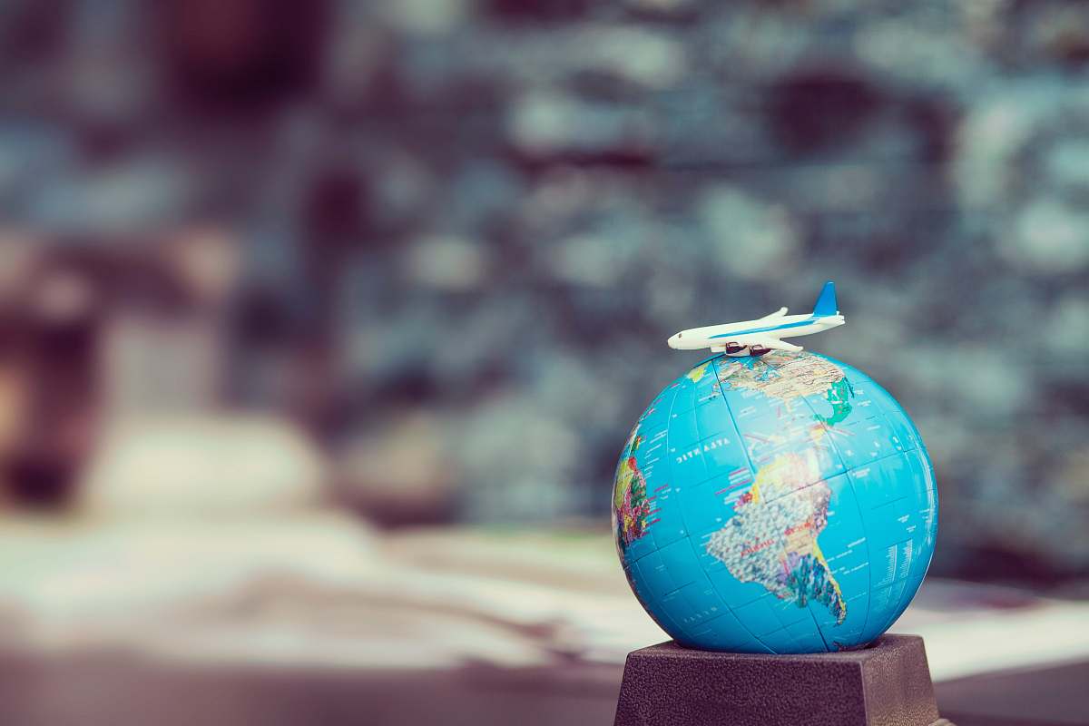 travel selective focus photo of desk globe blue