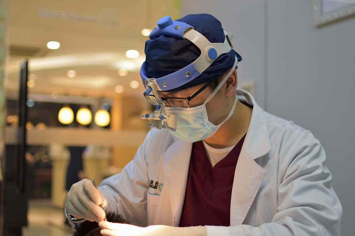 clothing man wearing mask and head light helmet