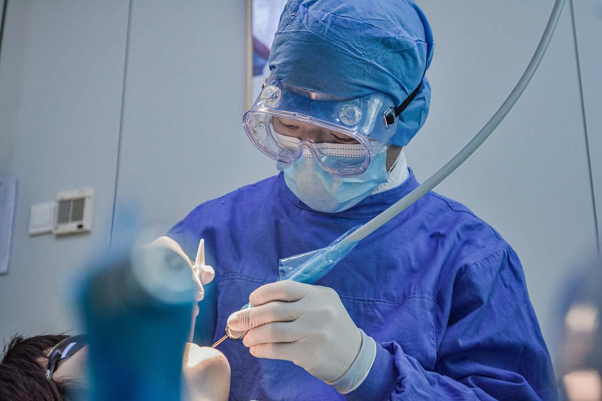 clothing person in blue long sleeve shirt wearing blue goggles helmet