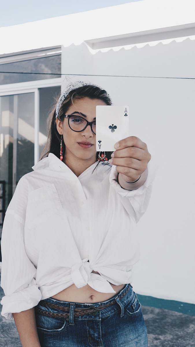 clothing woman holding deck card coat