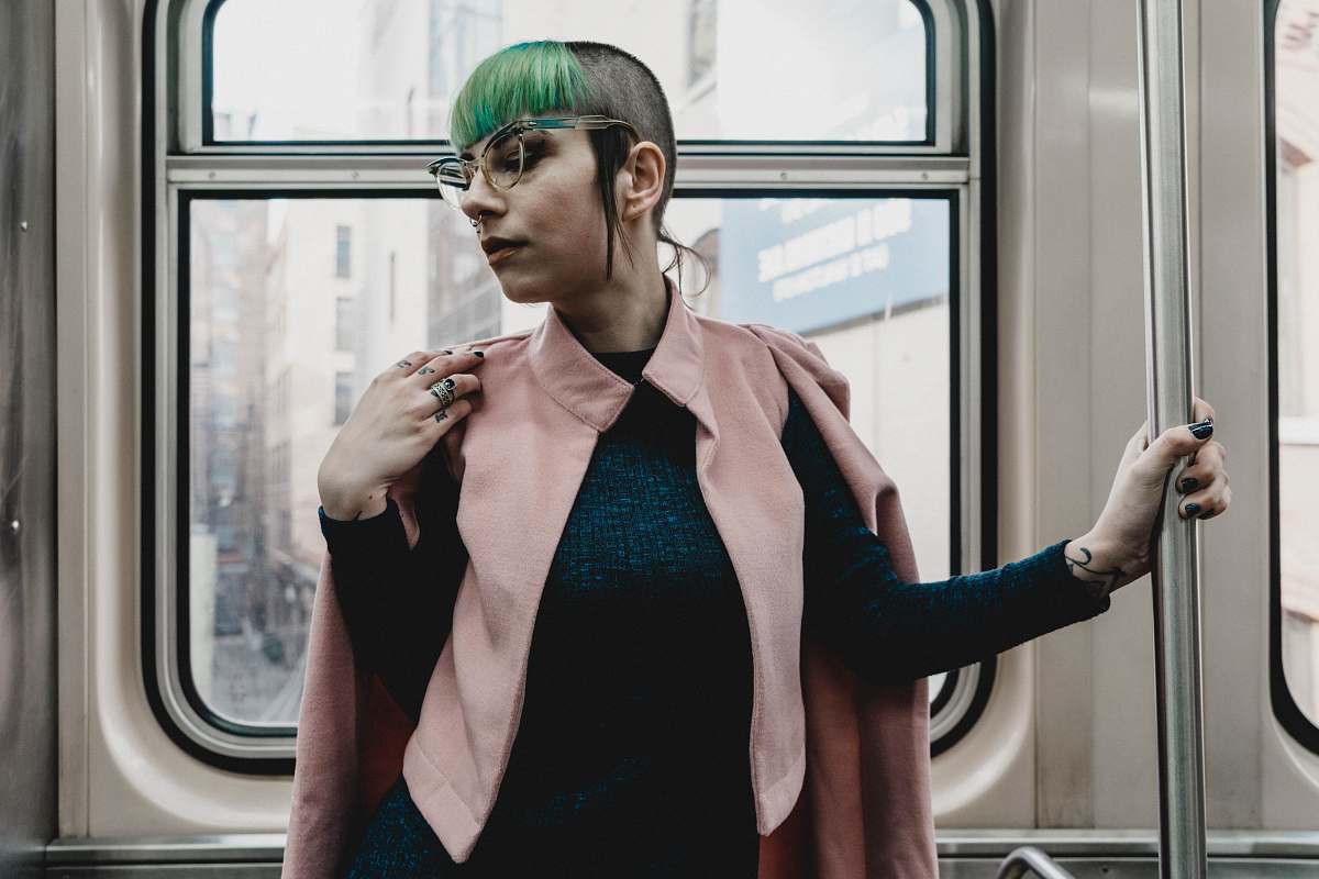 clothing woman standing inside train on focus photography sleeve