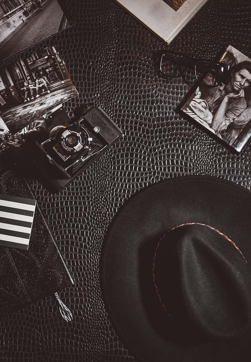 hat camera beside black hat photo