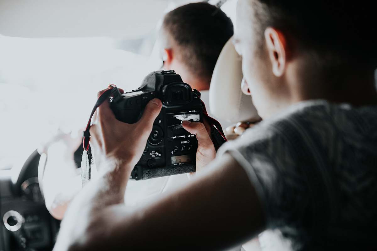person person holding camera human
