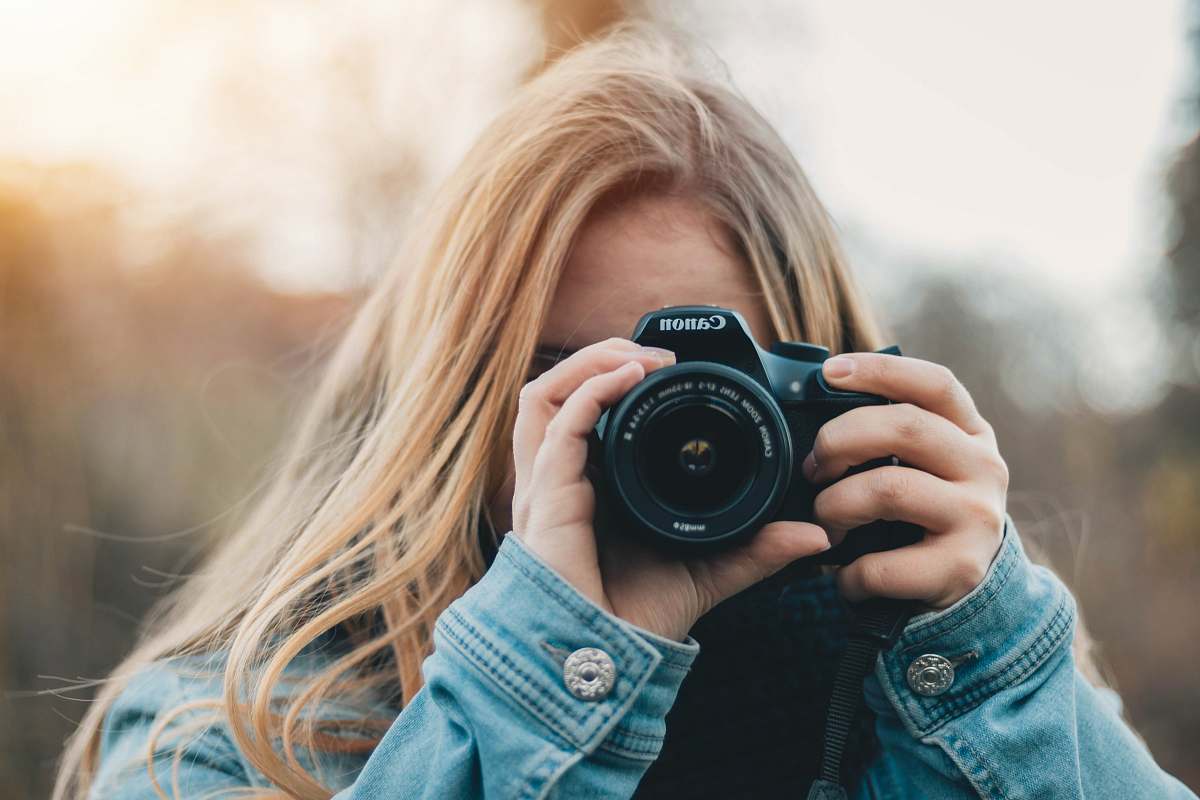 human woman taking photo during daytime person