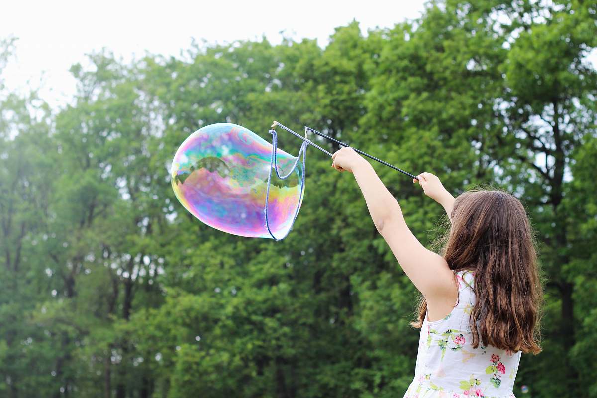 people girl making bubbles during daytime bubble