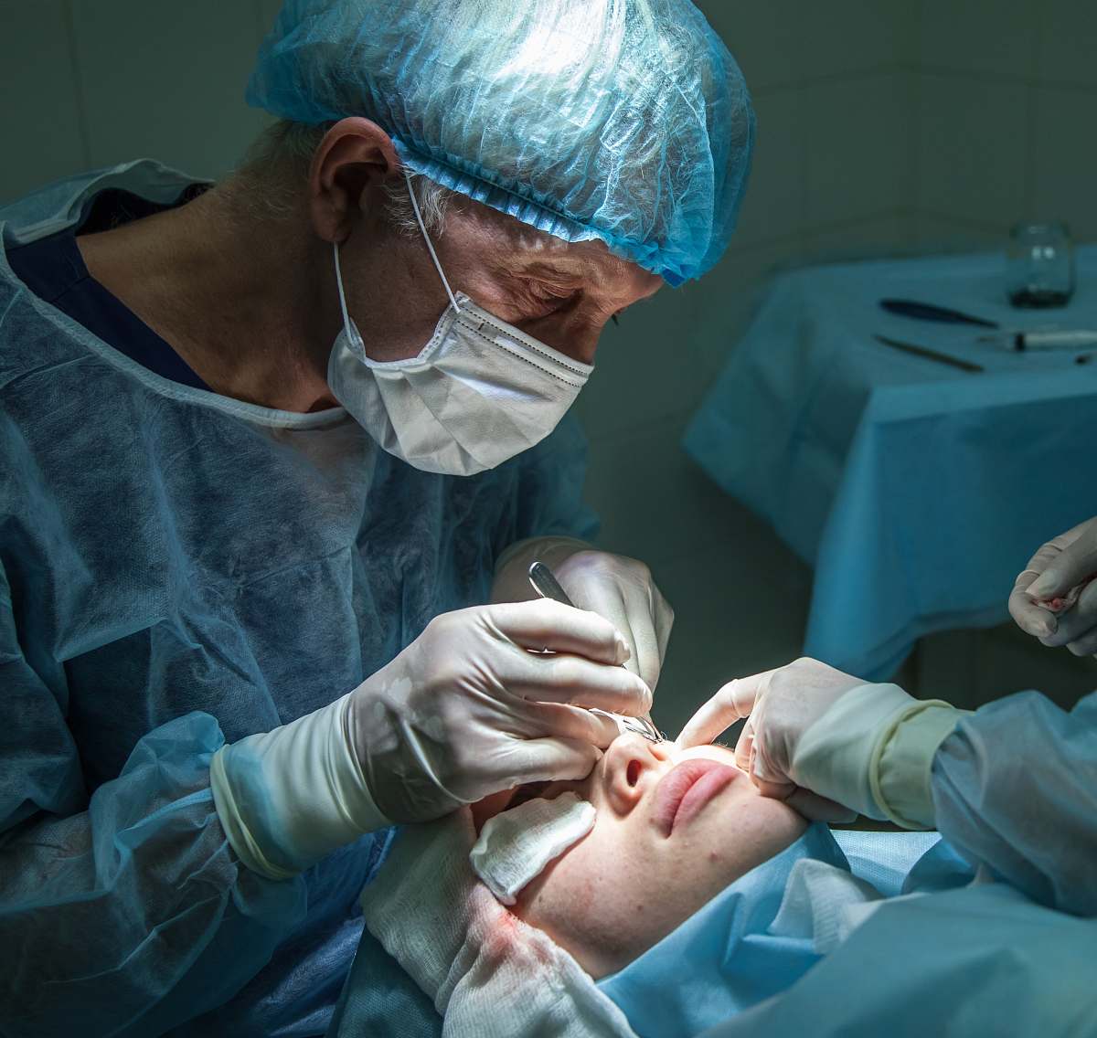 hospital doctor conducting operation at patient in operating room doctor