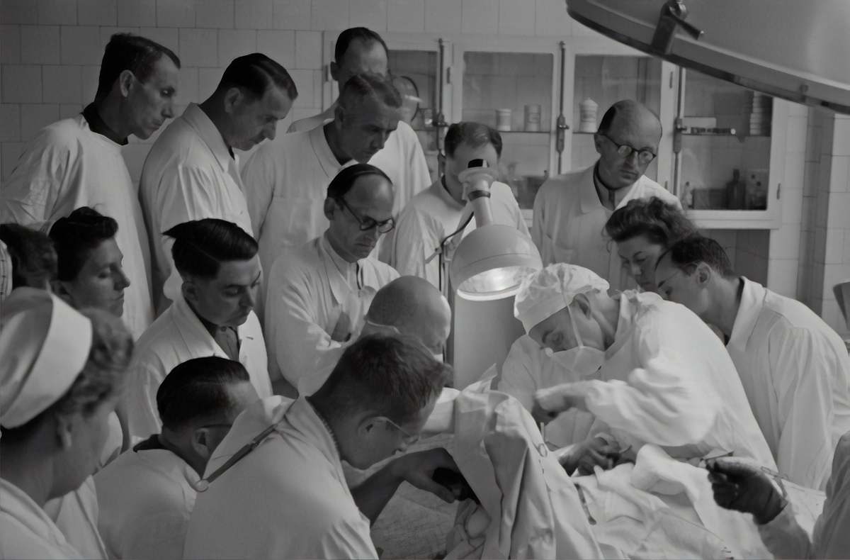 hospital photography of people watching watching operation inside room black-and-white