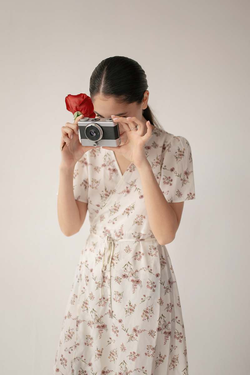 clothing woman holding camera apparel