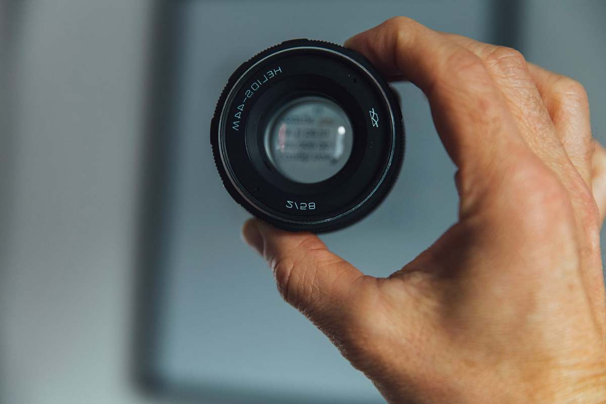 lens person holding camera lens camera