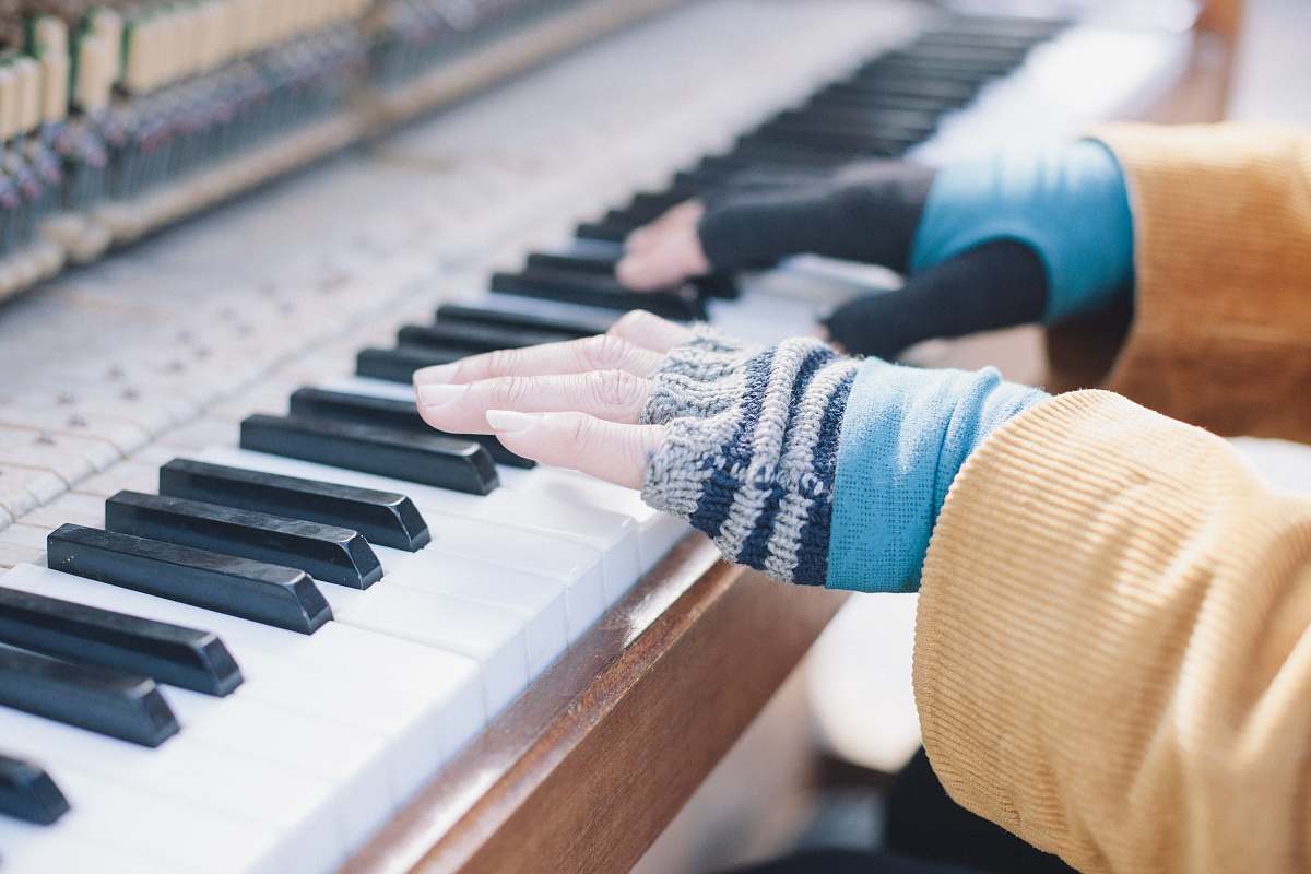 gloves person playing piano music