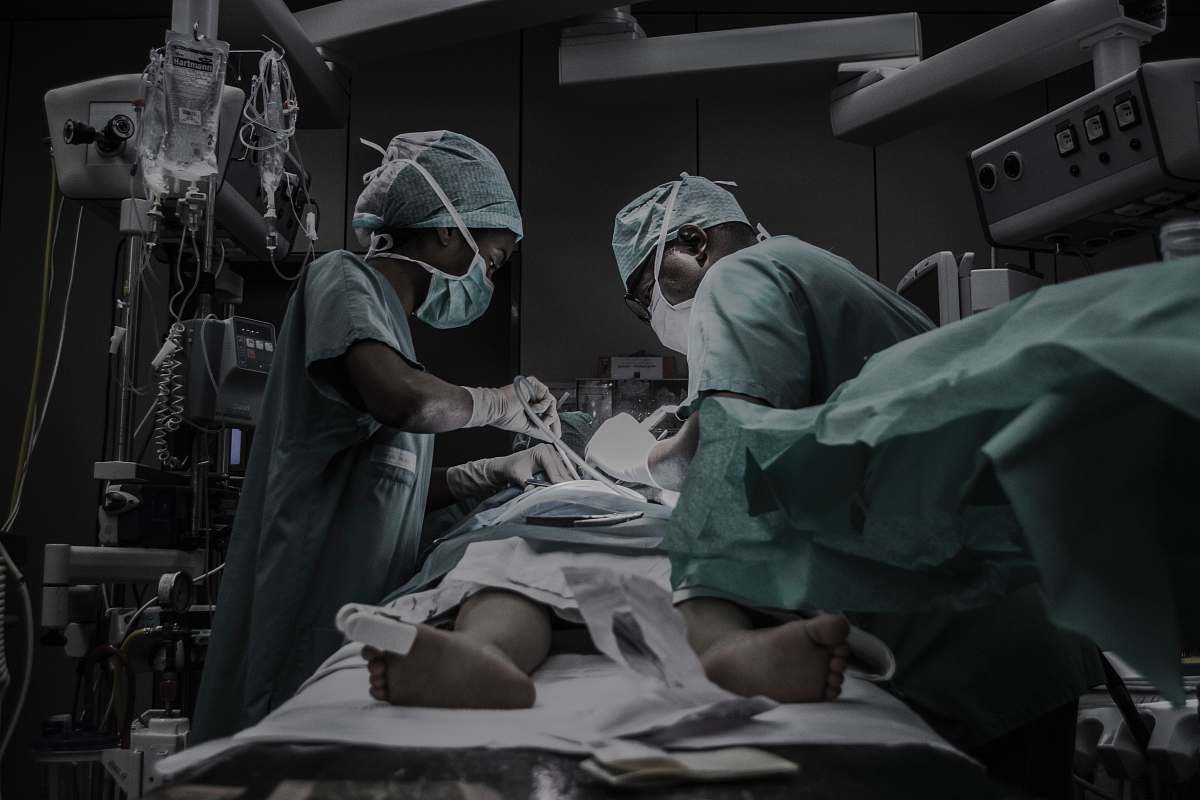 person doctors treating patient people