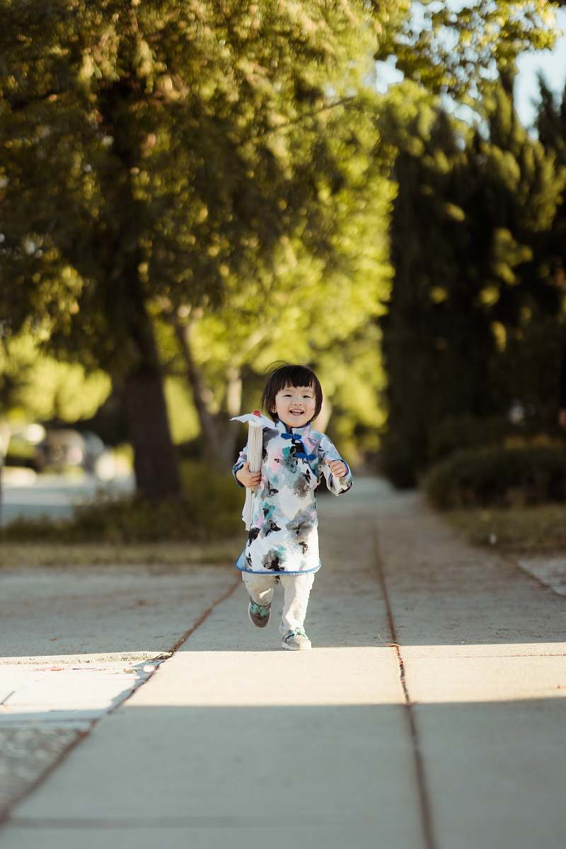 people girl walks on gray concrete pathway person