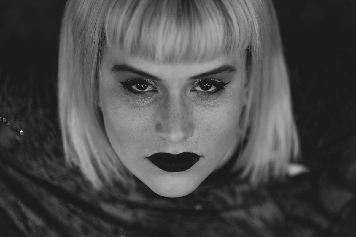person grayscale photo of woman black-and-white