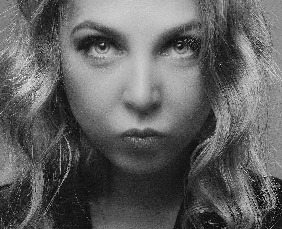 person greyscale photo of woman face