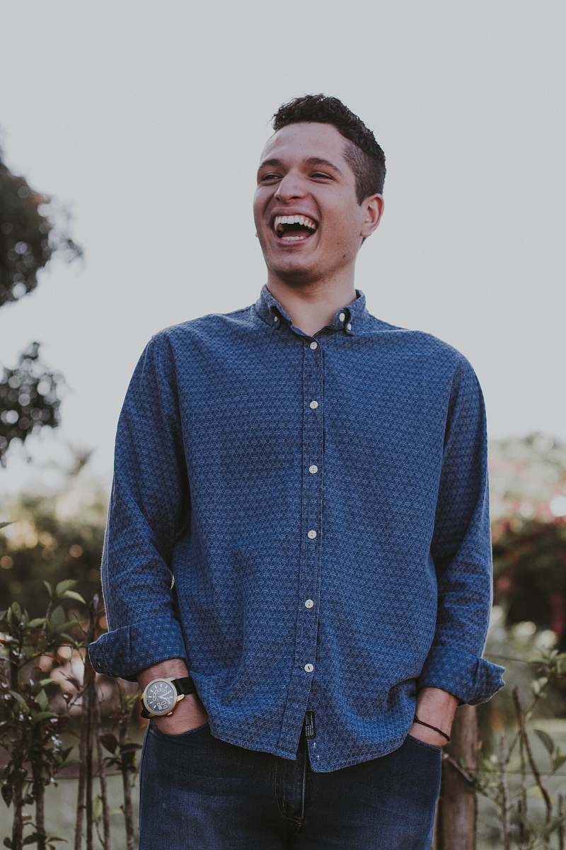 people man hands on both pockets while laughing person