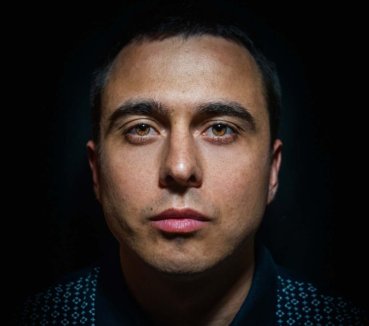 person man in black and white top face