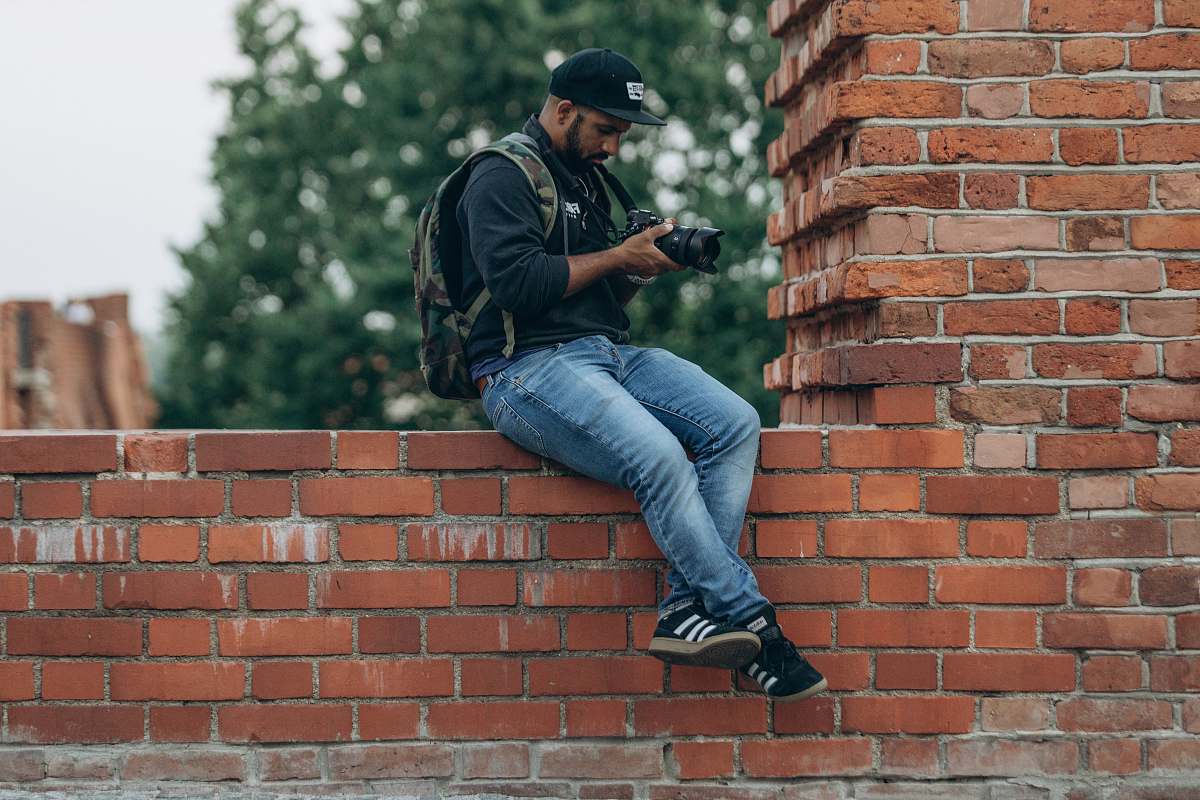 person man in blue jeans apparel