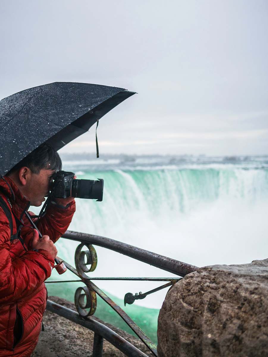 person man taking photo photo