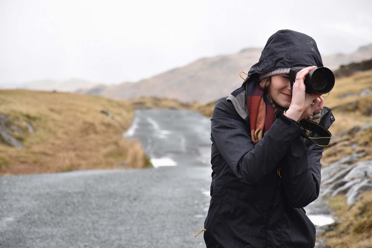 person photo of woman taking pictures people