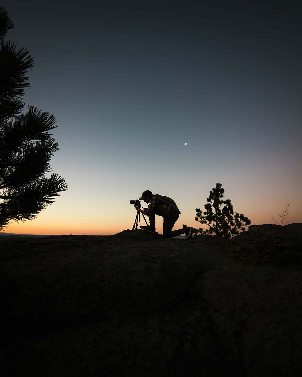 person silhouette  photography  of man  capturing photo 