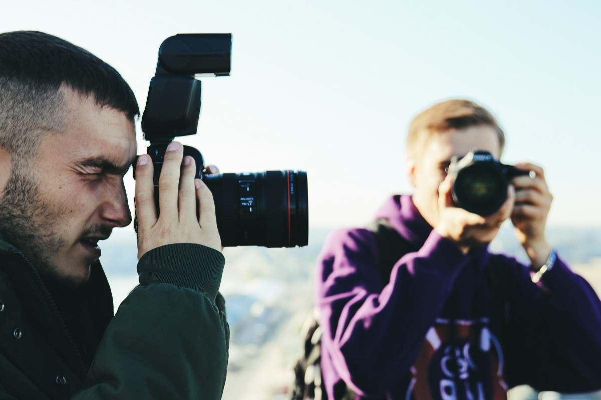 person two men taking photo photographer