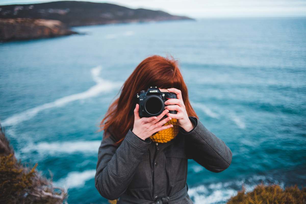person woman taking photo photography camera