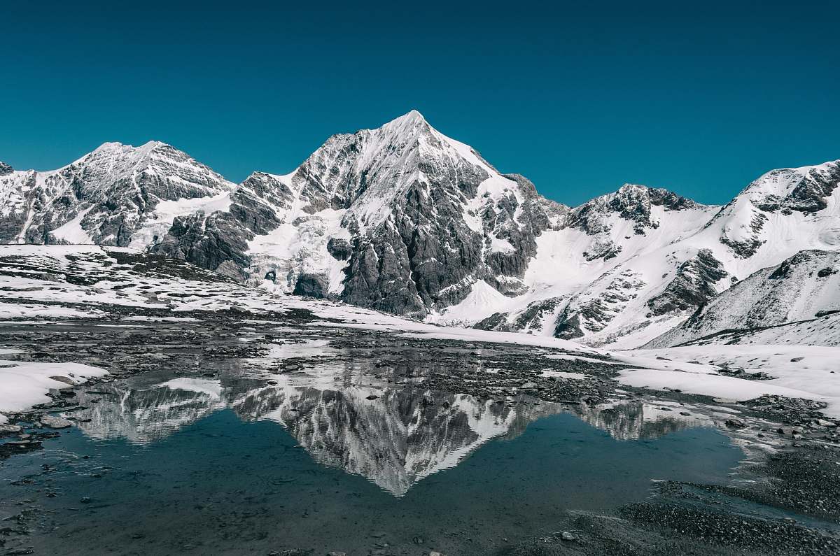 mountain mountain coated with snow snow