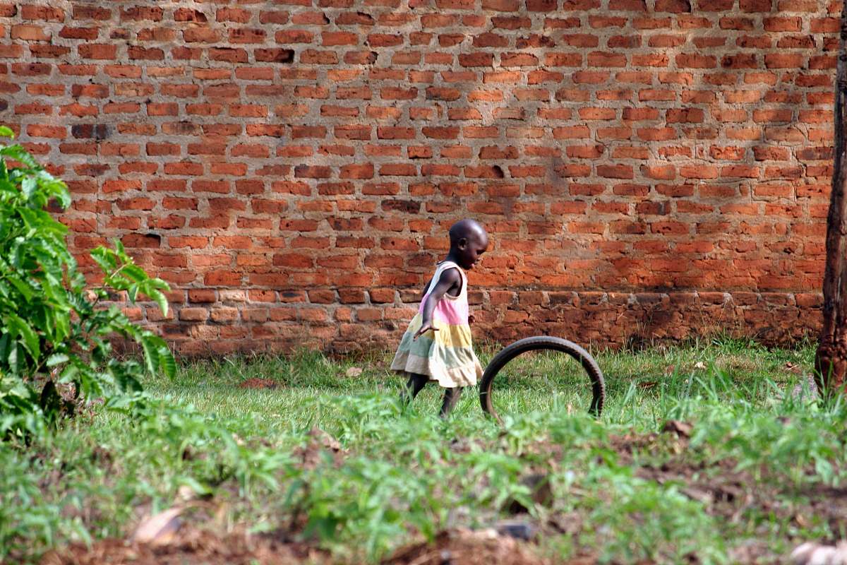 brick girl playing bike wheel child
