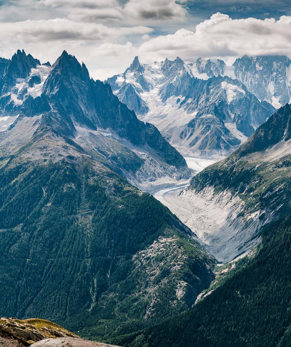 nature aerial view photography of mountains under cloudy sky glacier