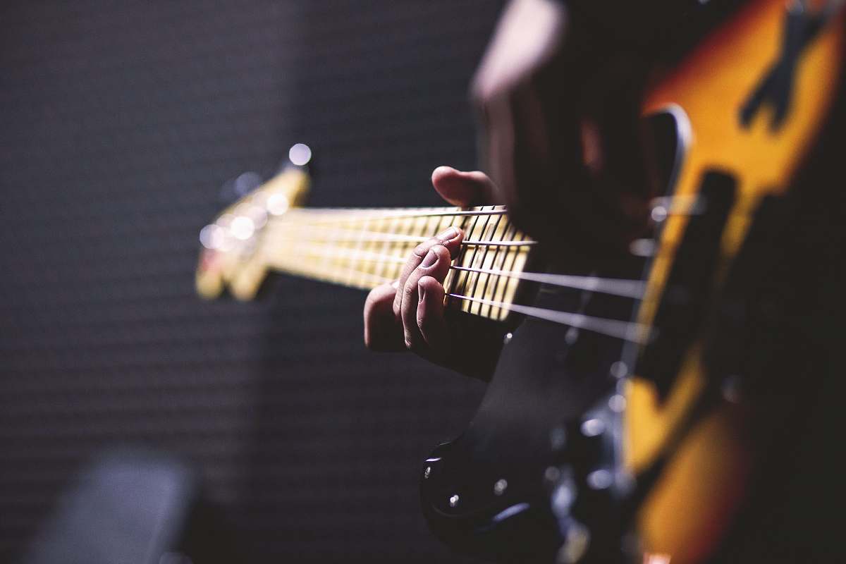 guitar closeup photo of person playing guitar electric guitar