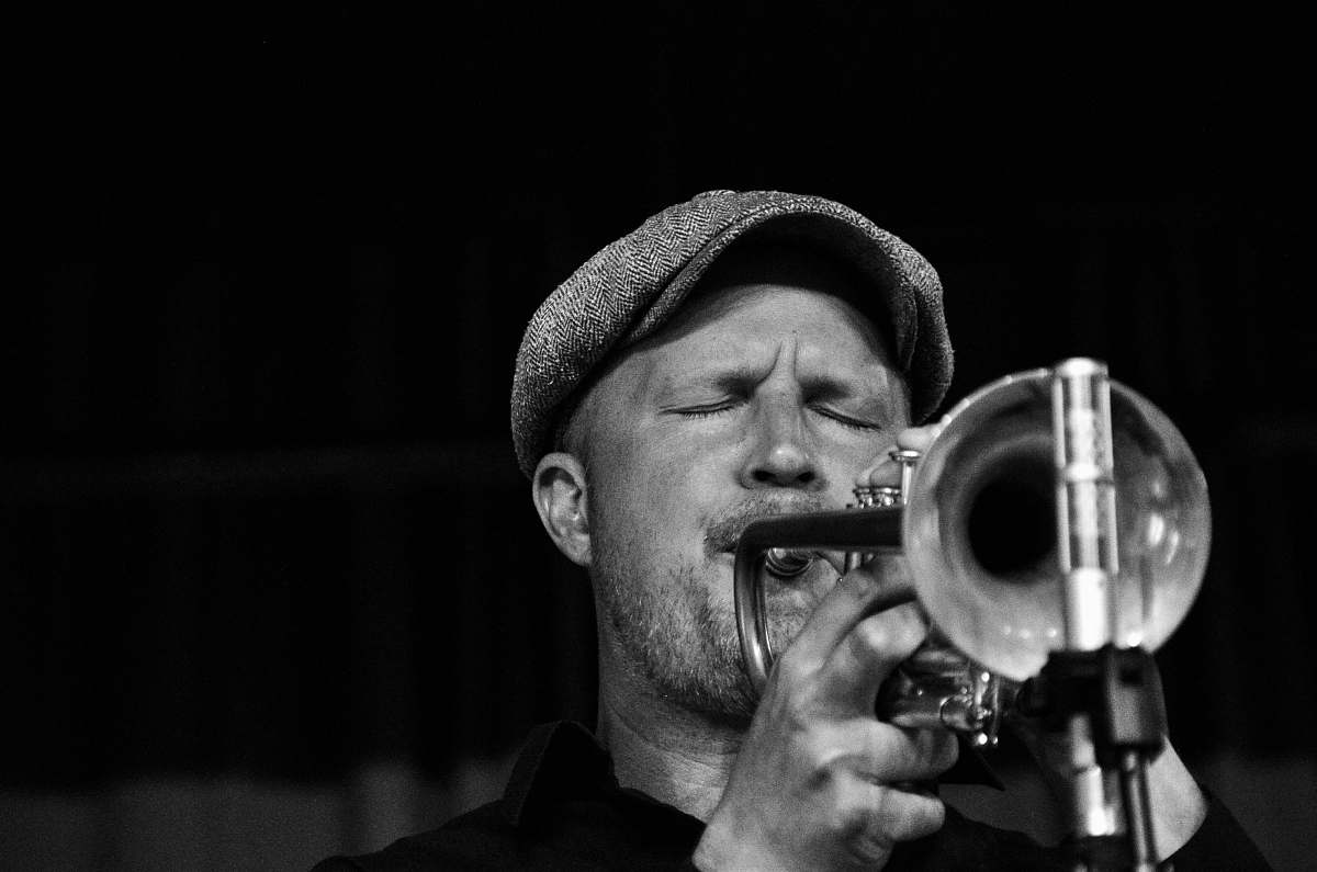 black-and-white grayscale photo of musician trumpet