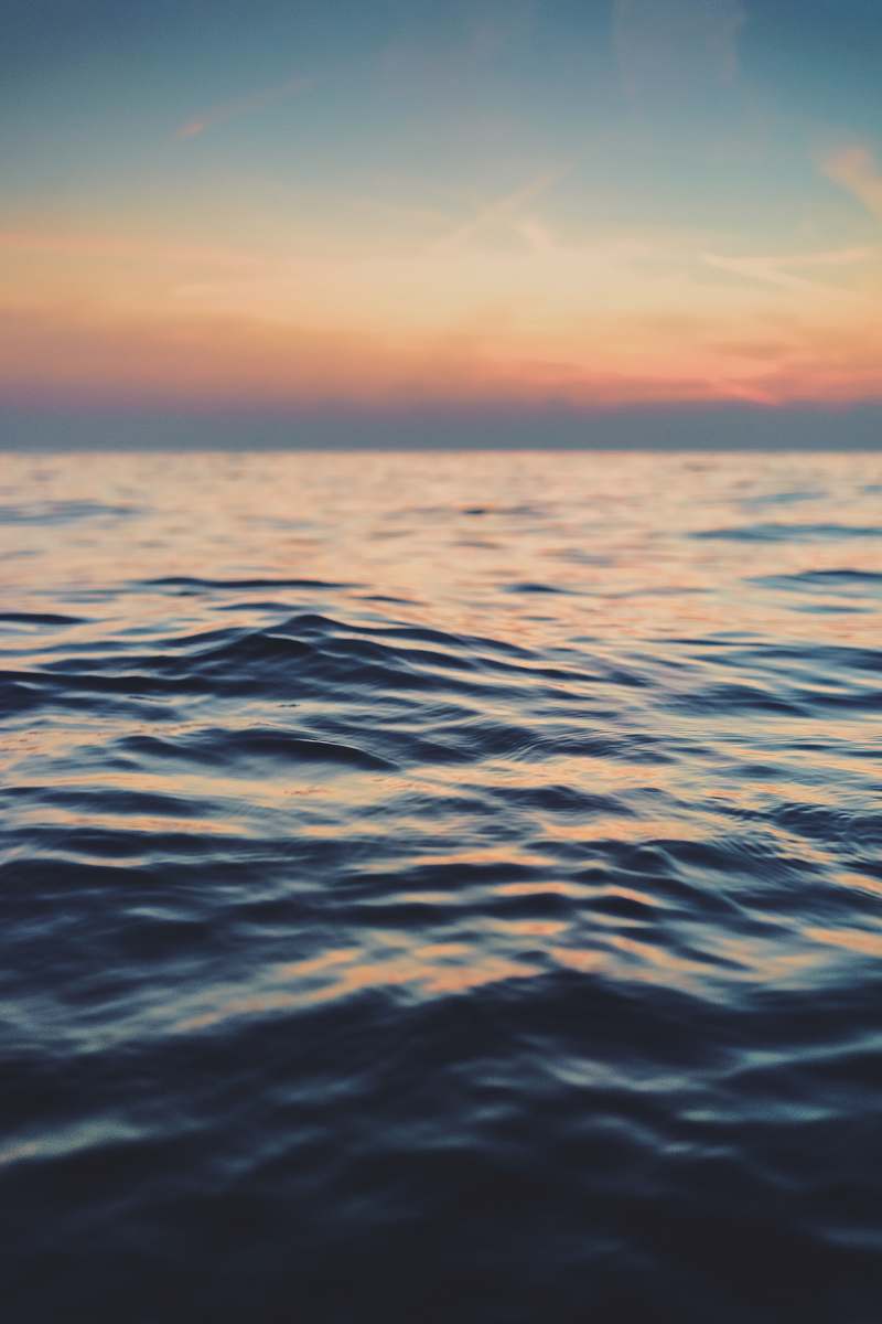 ocean calm body of water at golden hour water