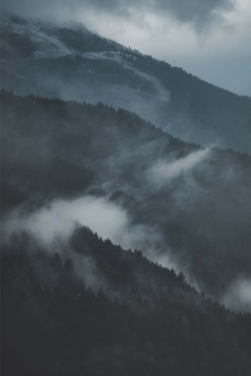 grey mountain covered by fog isolaccia