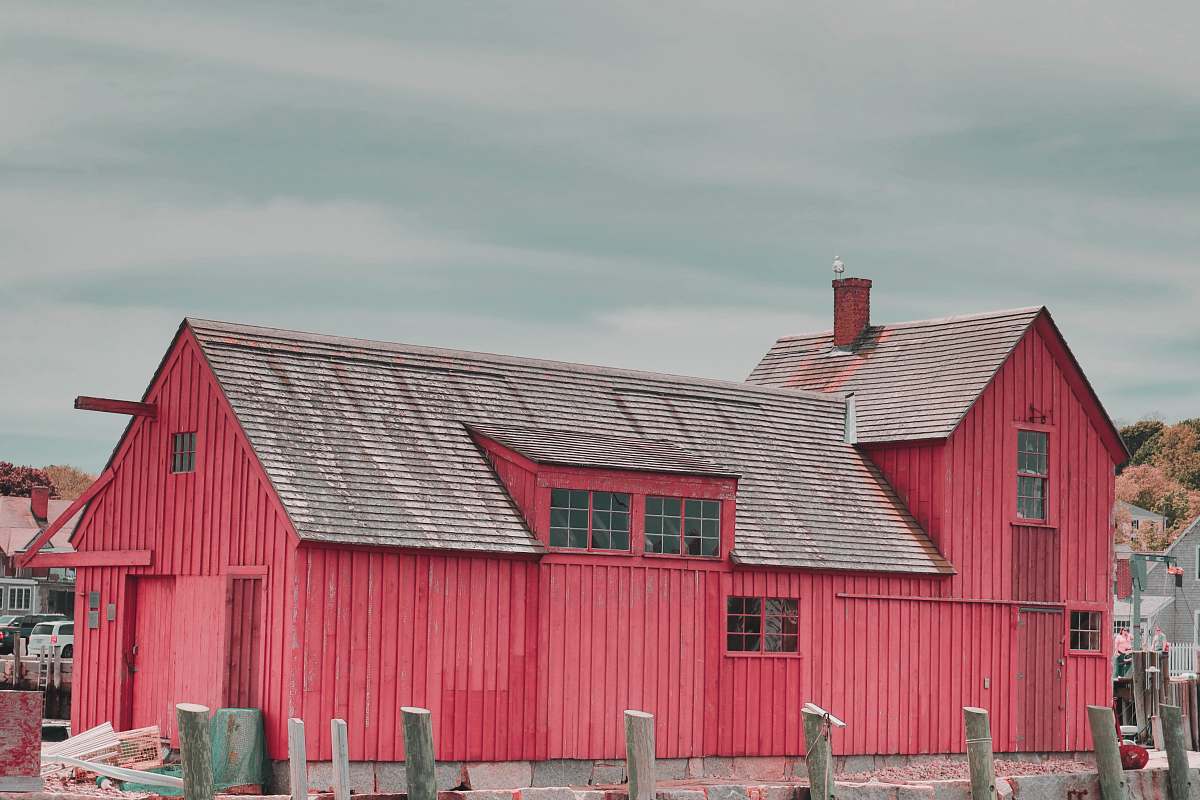 outdoors red wooden shed barn