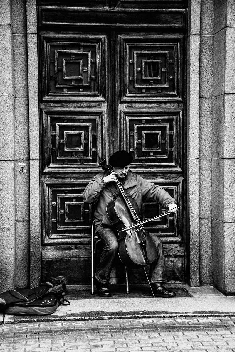human illustration of person playing cello black-and-white
