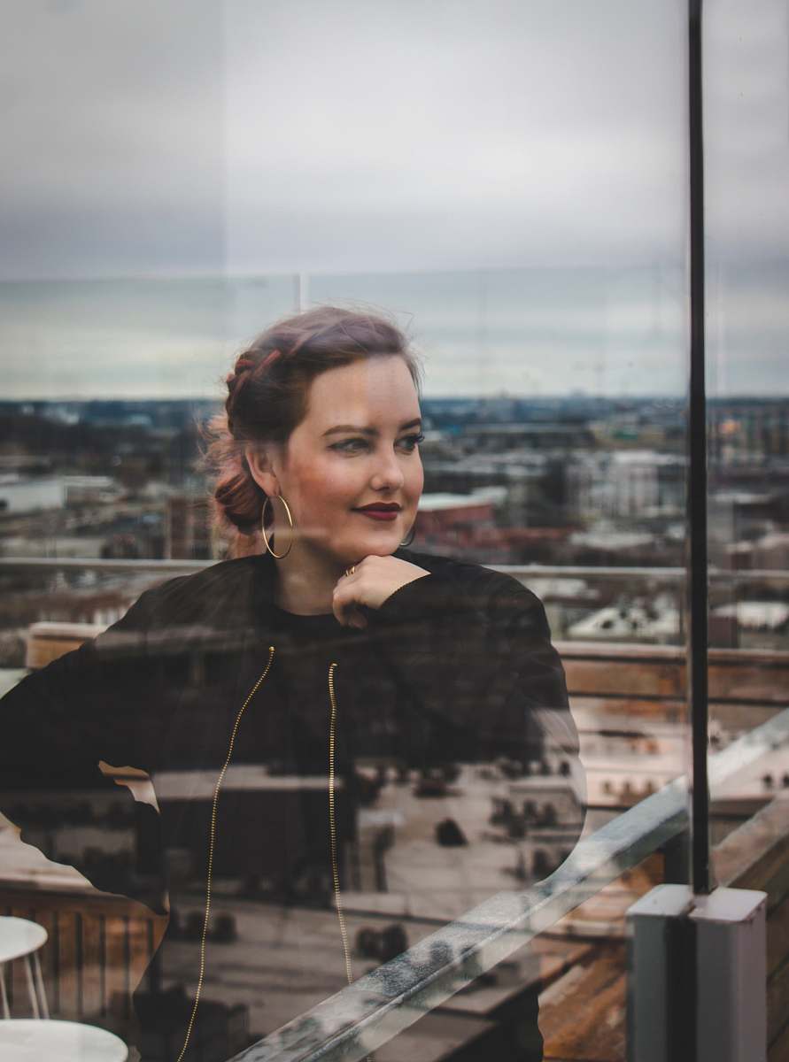 human woman standing in front of mirror person