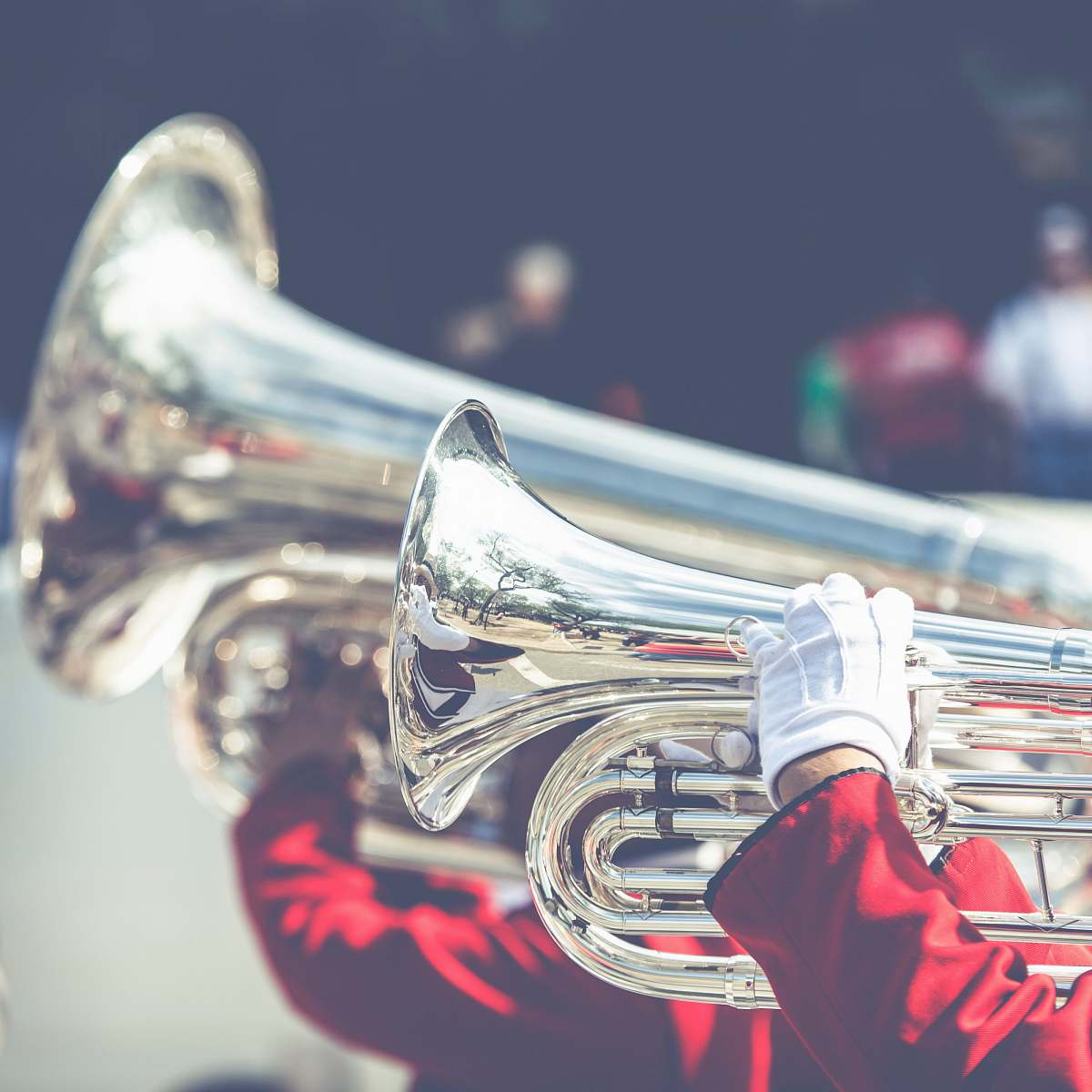 music close up photo of person playing horn instrument horn