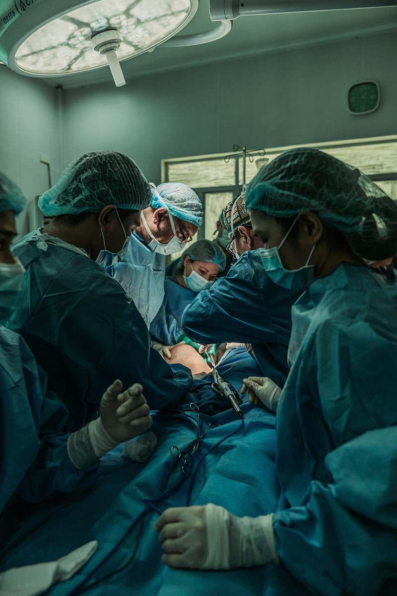 human doctor performing operation clinic