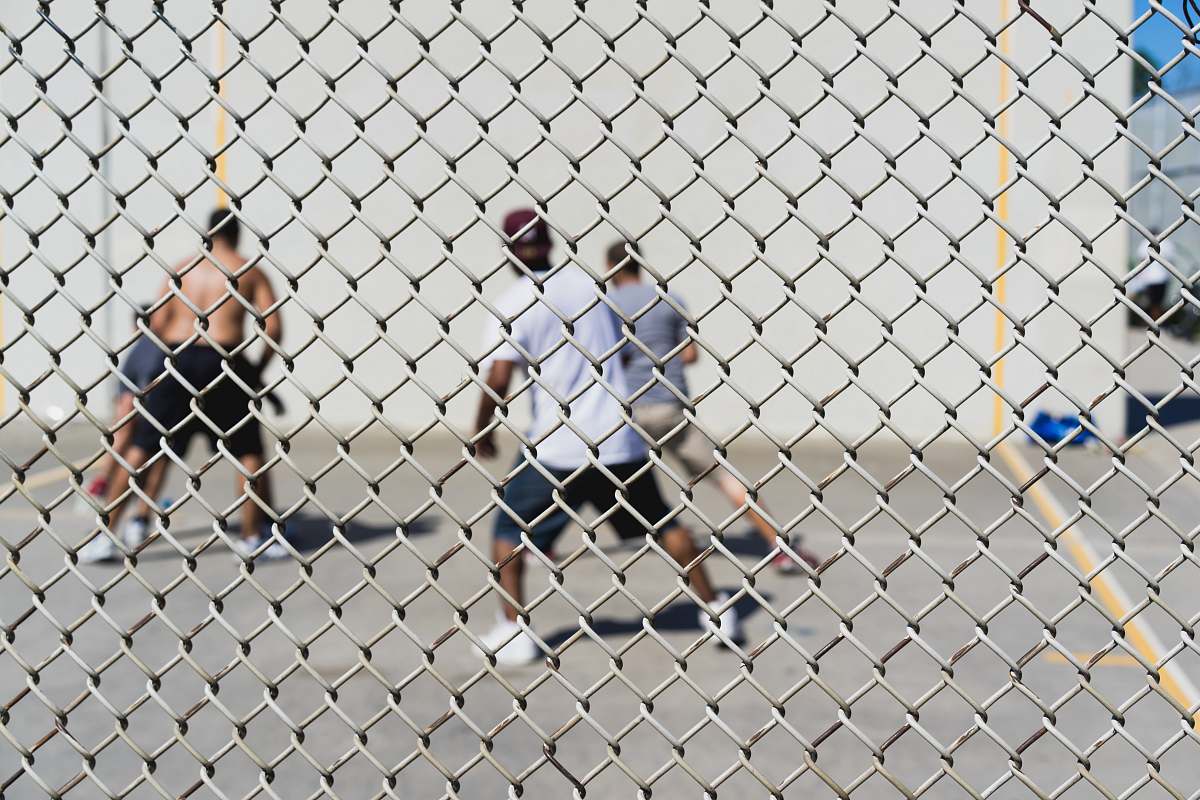 people four men playing basketball human