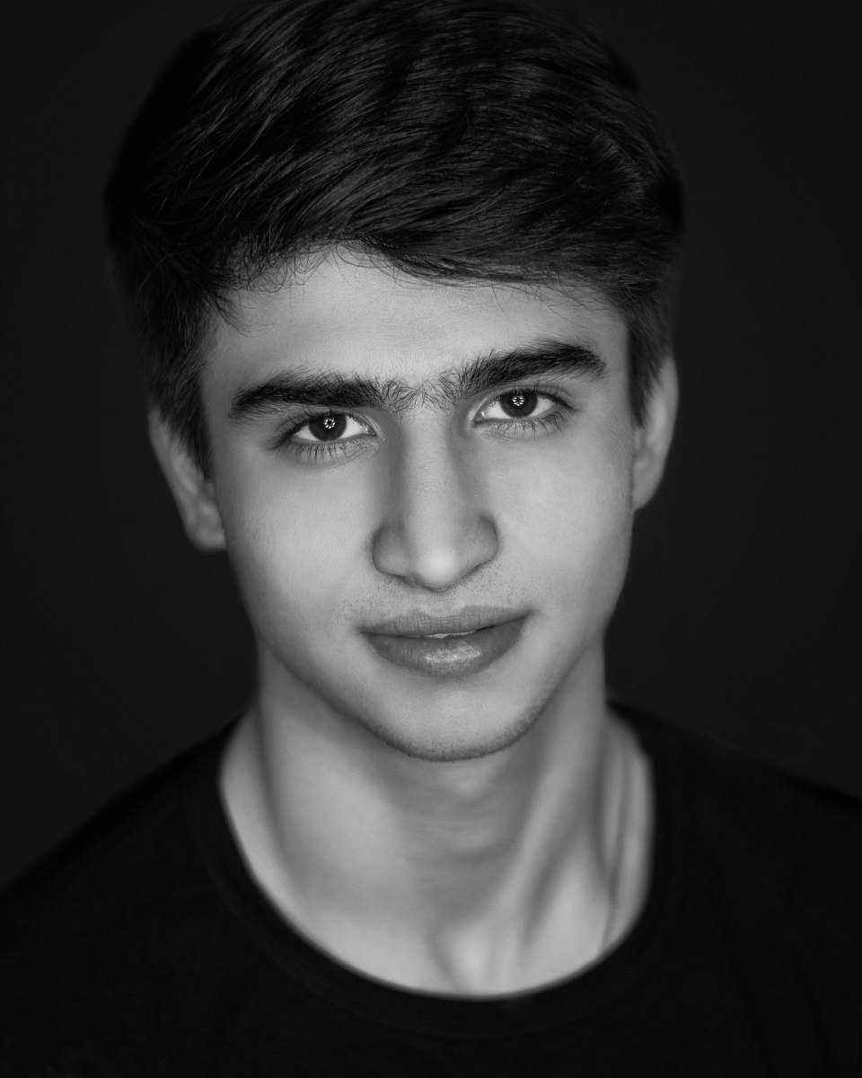 black-and-white grayscale photo of man in crew-neck shirt face