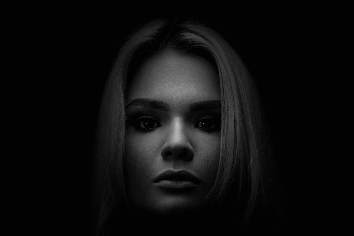 black-and-white grayscale photo of woman's face face