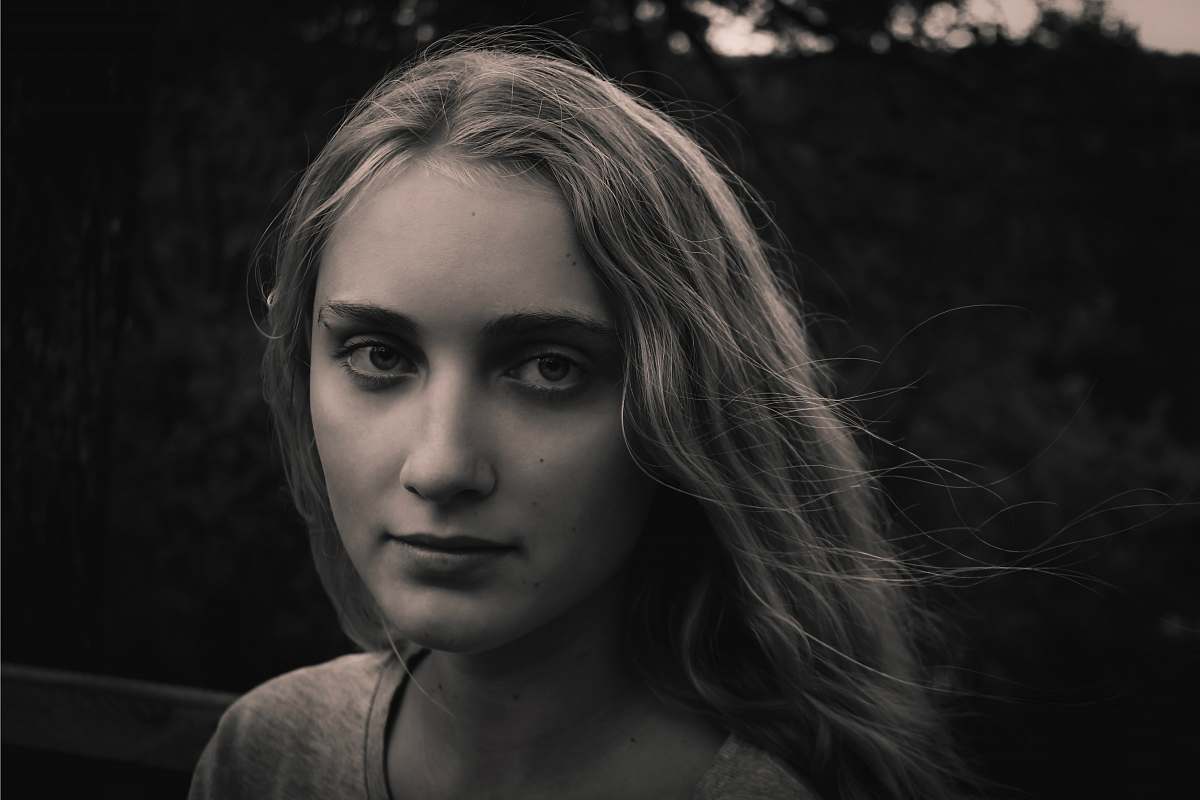 human greyscale photo of woman wearing shirt face