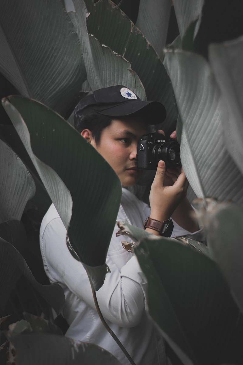 human man in black cap photography